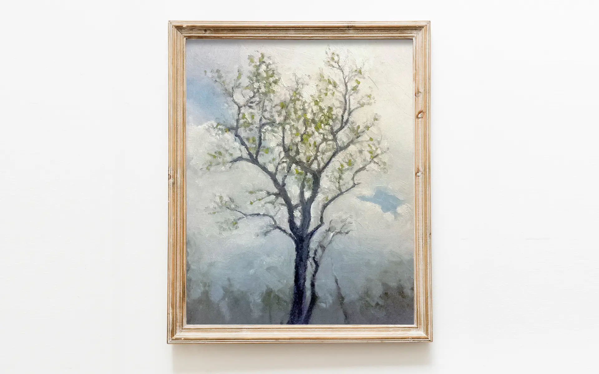 art print of oil painting depicting a tree in the winter, with an emphasis on the clouds behind it and its silhouette of bare branches